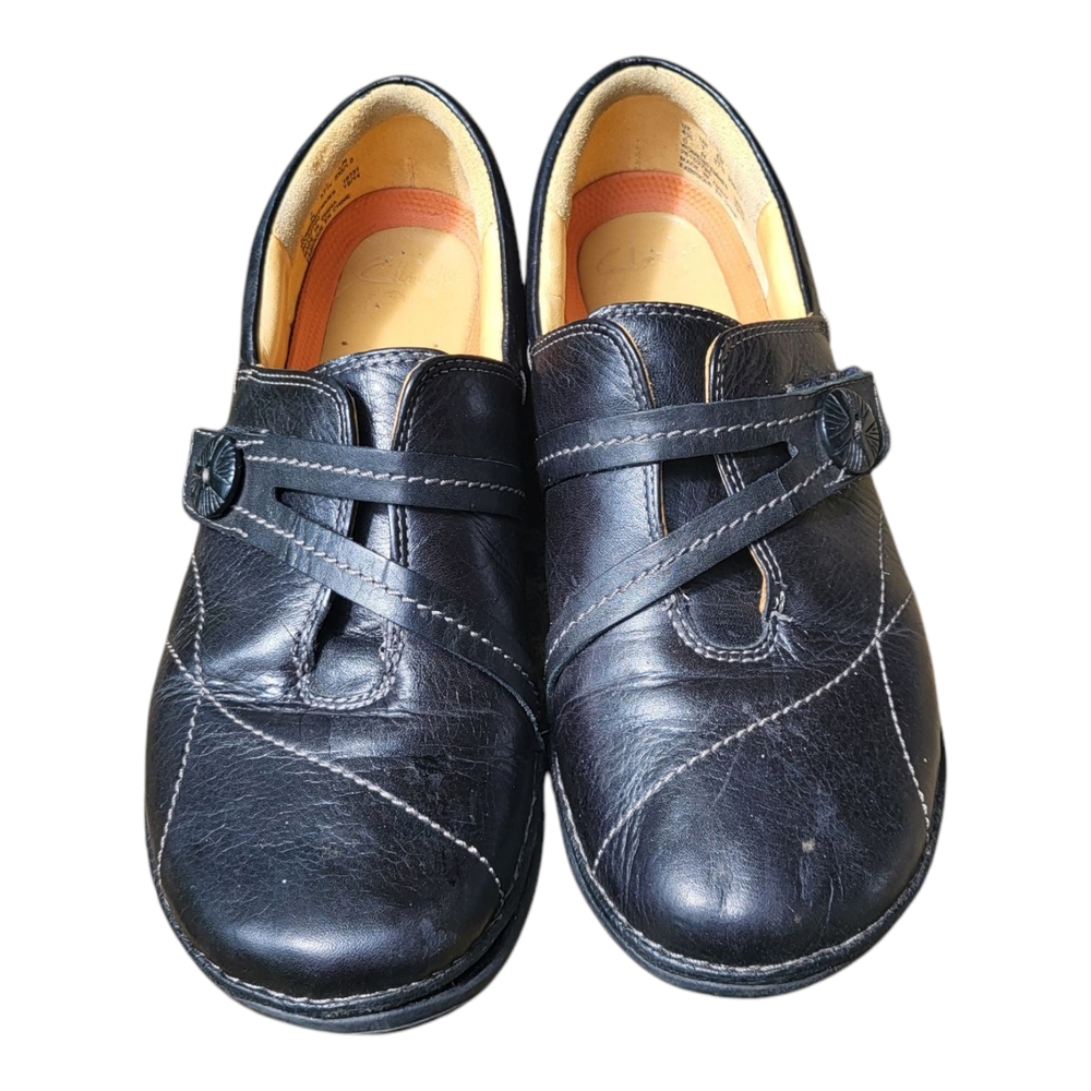 Stylish Black Slip-On Shoes with Strap Accent